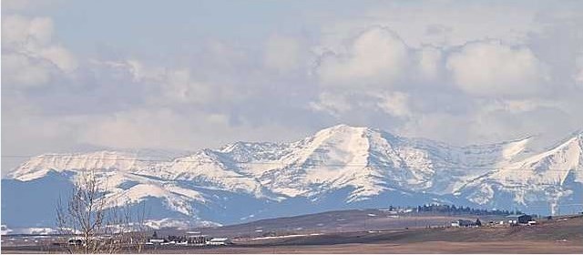 THE MOUNTAINS FROM OKOTOKS